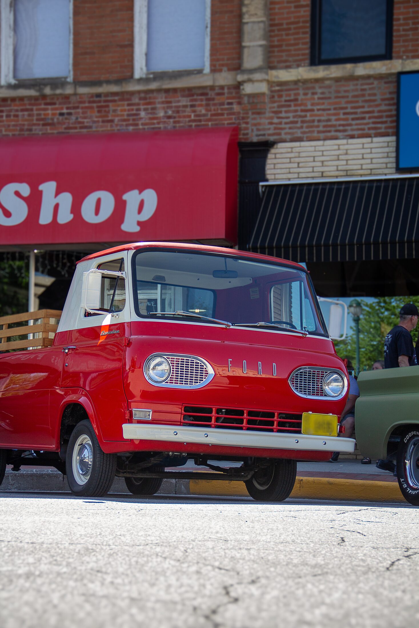 Vintage red vehicle at a community car show