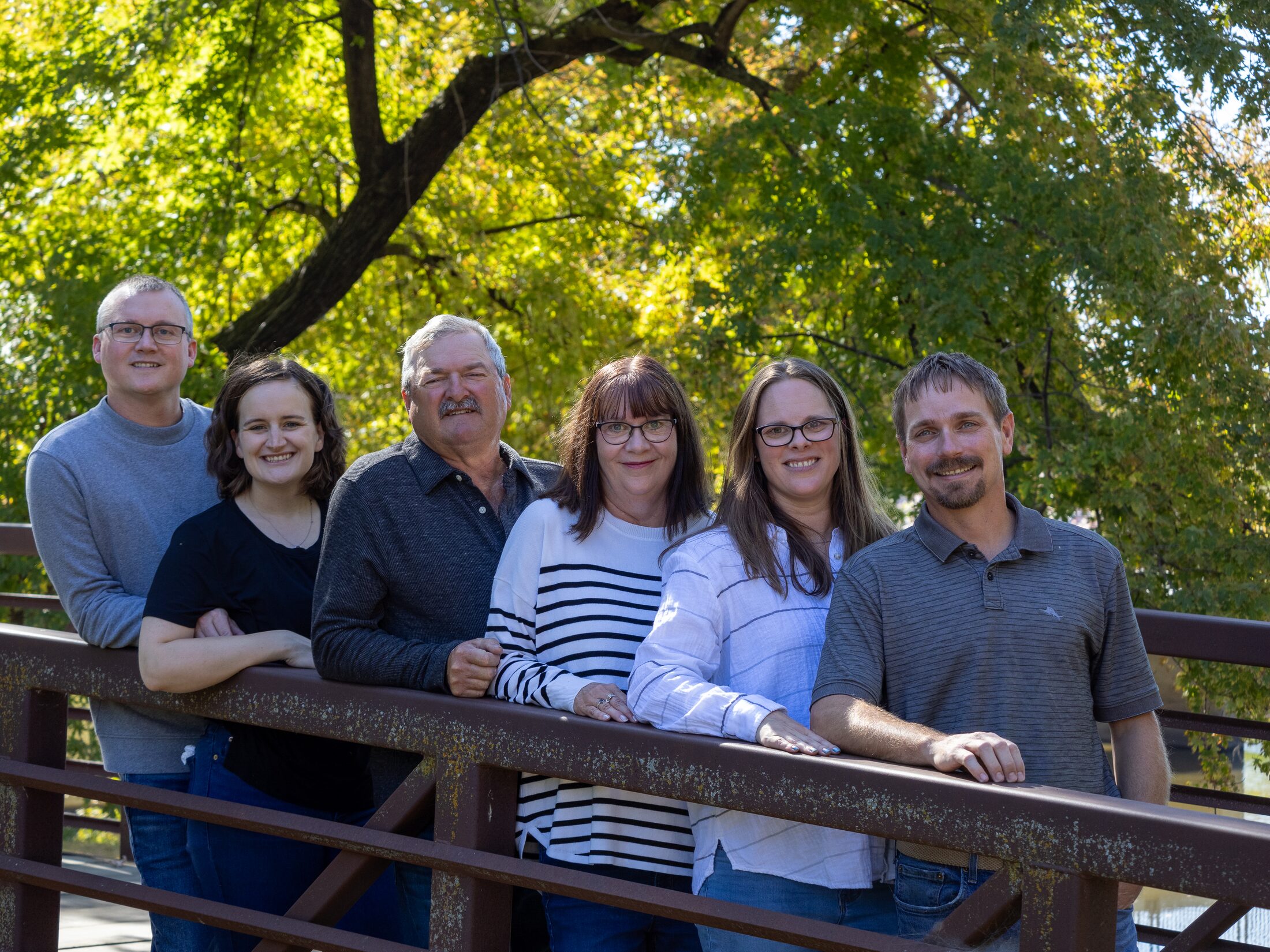 Multi-generation family portrait outdoors