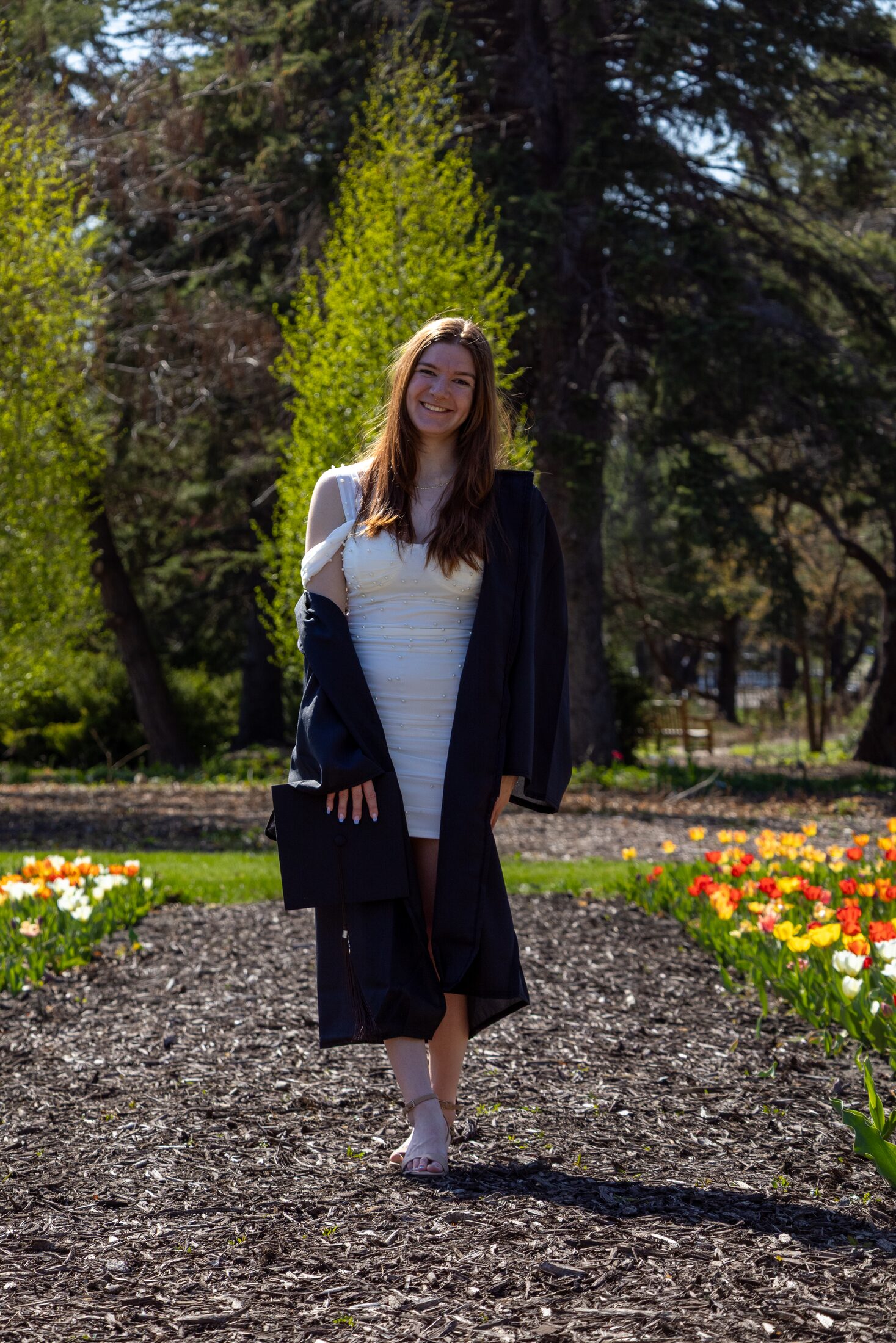 Graduation portrait among spring flowers