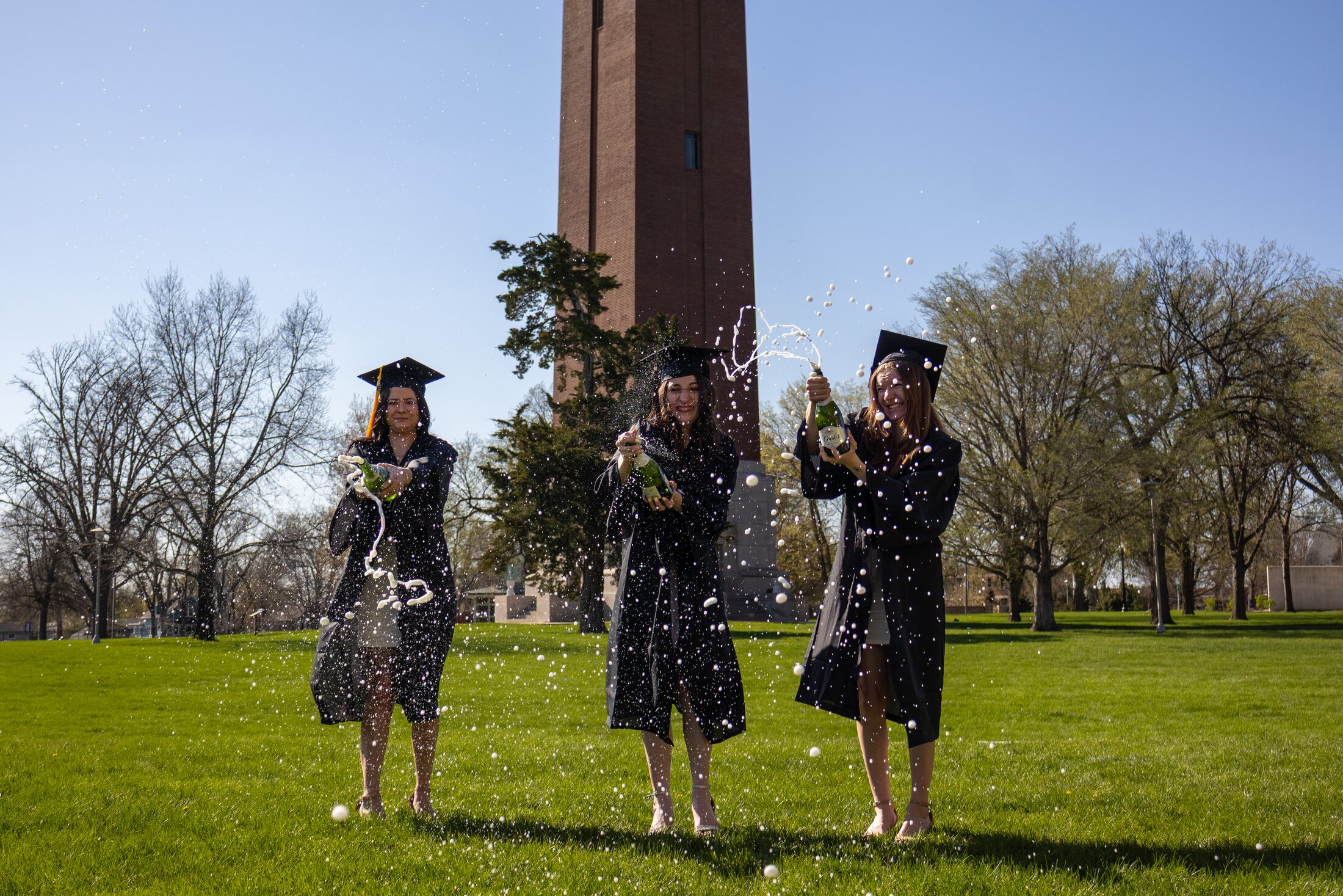 Graduates celebrating together on campus